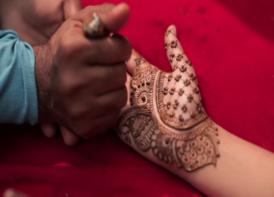 A Shot of Applying Mehndi on Bride's hand at her Indian Wedding in New Delhi, India