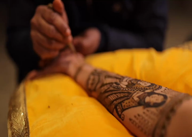 A Slow Motion Shot of Applying Mehndi on Bride's hand at her Indian Wedding in India