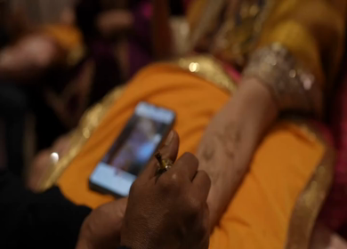 A Slow Motion Shot of Applying Mehndi on Bride's hand at her Indian Wedding in India