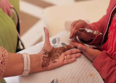 A Slow Motion Shot of Applying Mehndi on Bride's hand at her Indian Wedding in India