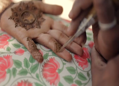 A Slow Motion Shot of Applying Mehndi on Bride's hand at her Indian Wedding in India