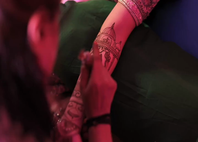 A Slow Motion Shot of Applying Mehndi on Bride's hand at her Indian Wedding in India