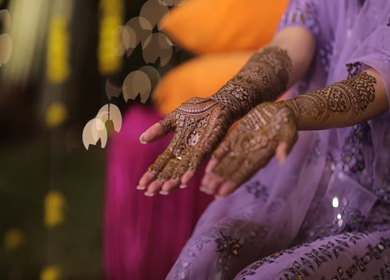 A Shot of Indian Bride showing Mehndi in her Hands at her Indian Wedding in New Delhi, India