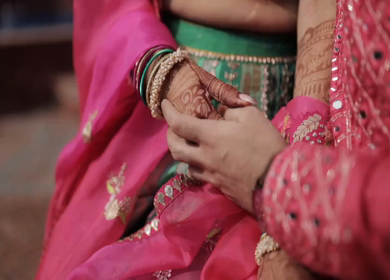 A Slow motion shot of a Indian Groom and Indian Bride posing towards camera at their Indian wedding in India