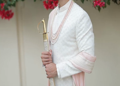 A shot of an Indian Groom posing for the photoshoot at his Indian Wedding