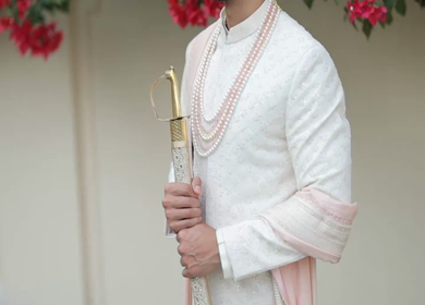 A shot of an Indian Groom posing for the photoshoot at his Indian Wedding