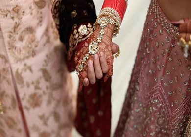 A slow motion Shot of an Indian Couple Holding Hands at their Indian Wedding Cocktail 